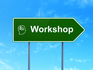 Education concept: Workshop and Head With Finance Symbol on road