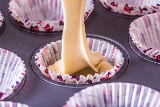 pouring cake mix in to the baking tray