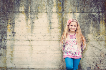 girl  in front of a wall