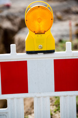 yellow signal lamp on construction site