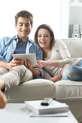 Fototapeta premium Couple watching movie on tablet