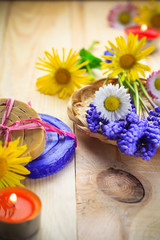 Obraz na płótnie Canvas Handmade soap flowers wooden table