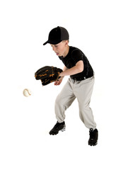 Young caucasian baseball player backhanding a ground ball © sixdays