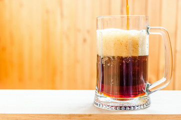 Beer pouring into mug