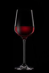 red wine in glass on black