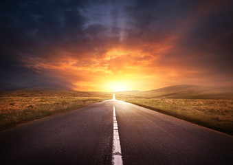 Road Leading Into A Sunset - obrazy, fototapety, plakaty