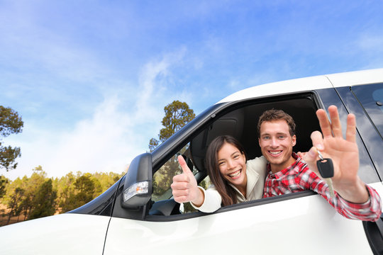 New Car - Happy Couple Showing Car Keys