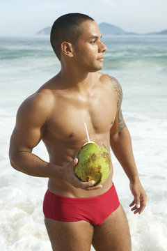Athletic Brazilian Man Drinking Coconut Rio Beach