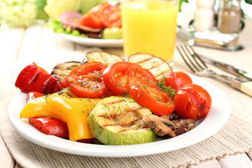 Delicious grilled vegetables on plate on table close-up