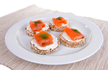 Delicious canapes on plate close-up