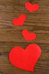Paper hearts on wooden  background