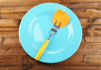 Empty note paper attached to fork,