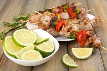 Pork kebab on wooden table close up