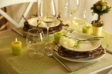 Beautiful holiday Easter table setting in green tones,