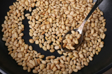 Cedar pine nuts on pan, close up