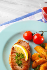 Grilled steak, grilled vegetables and fried potato pieces