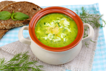 Tasty soup in saucepan, isolated on white