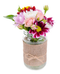 Naklejka na ściany i meble Beautiful bouquet of bright flowers in jar isolated on white