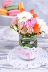 Beautiful bouquet of bright flowers in jar