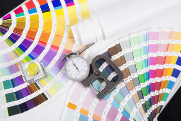 Lens , pantone and micrometer. Design and prepress concept