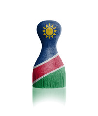 Wooden pawn with a flag painting