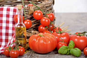 tomatoes with olive oil bottle