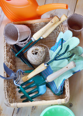 Gardening tools in a wicker basket