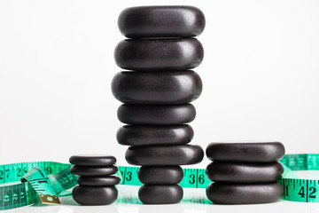Fototapeta na wymiar black pebble stones for spa massage
