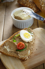Liver paste sandwich with vegetables arugula and boiled egg