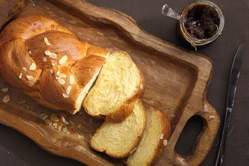 Fotobehang Sweet brioche bread on tray with knife and marmalade © viperagp