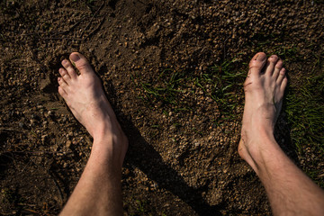 male bare feet on the way