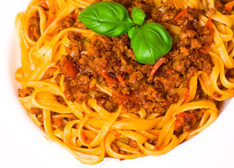 spaghetti bolognese on white plate
