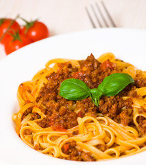 spaghetti bolognese on white plate
