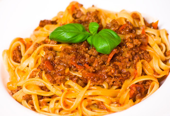spaghetti bolognese on white plate