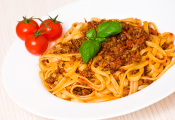 spaghetti bolognese on white plate