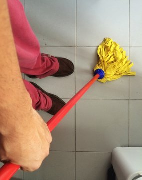 A man cleaning the floor