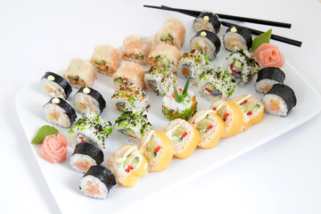 maki sushi set on white plate. Traditional japanese sushi rolls
