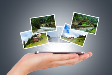 Hand and Digital Screen with Natural Photographies