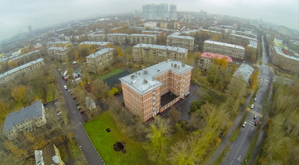 Fototapeta premium Road with cars acrossed residential areas with school