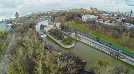 Yauza river with sluices of waterworks against the cityscape