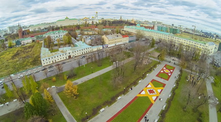 Fototapeta premium Cityscape with lawn ornaments against the kremlin and church