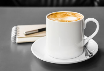 Coffee cup and saucer on the table