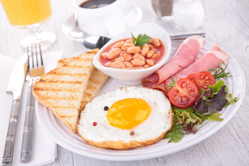 fried egg with toast and beans