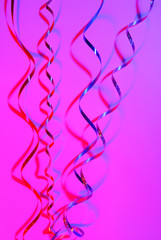 confetti serpentine ribbon on color background