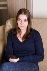 Fototapeta premium Cute girl watching TV at home