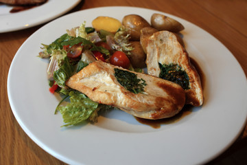 Slices of chicken stuffed with fresh herbs