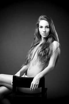 Young naked girl in studio