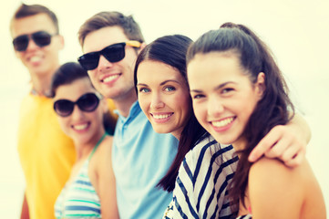 group of friends having fun on the beach