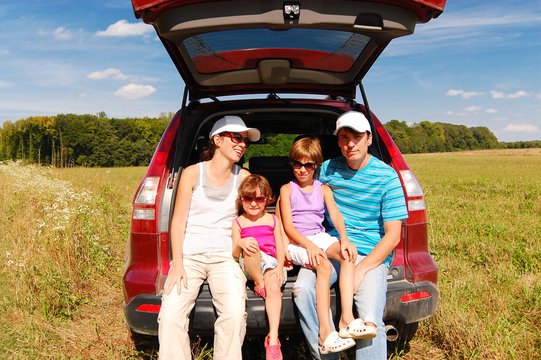 Family in car on vacation, parents and kids travel