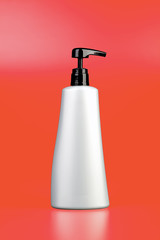 Plastic bottle on orange